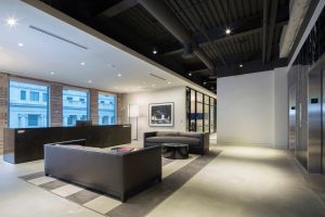 Graham and Co's adaptive reuse project features a sleek design the second you enter the space